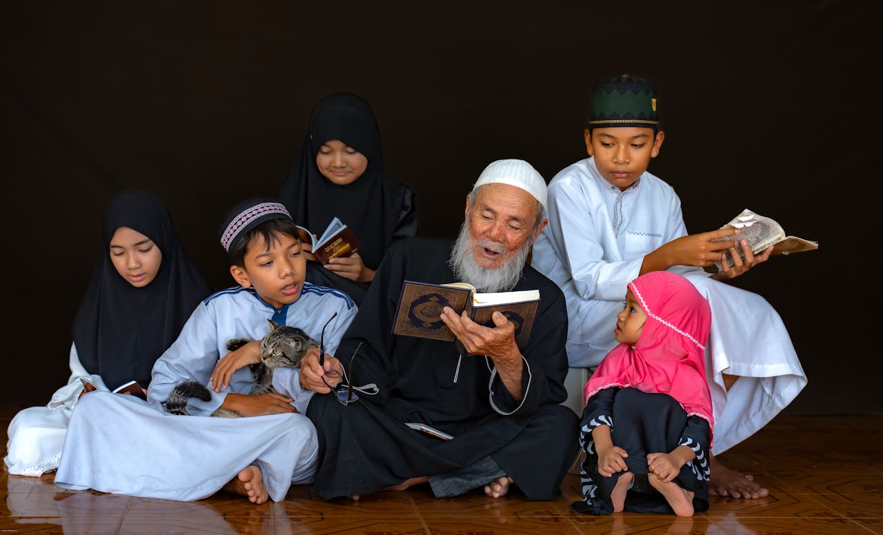 services-02 A multigenerational family reading the Quran together, emphasizing togetherness and faith.